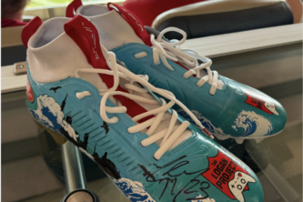 A pair of football cleats signed by Christian Mccaffrey of the San Francisco 49ers.